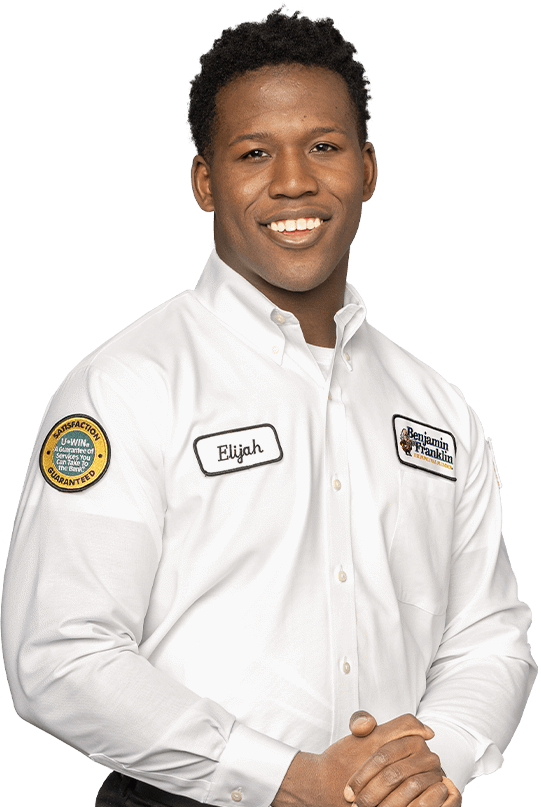 Smiling Benjamin Franklin Plumbing technician named Elijah.