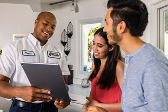 person showing folder to homeowners