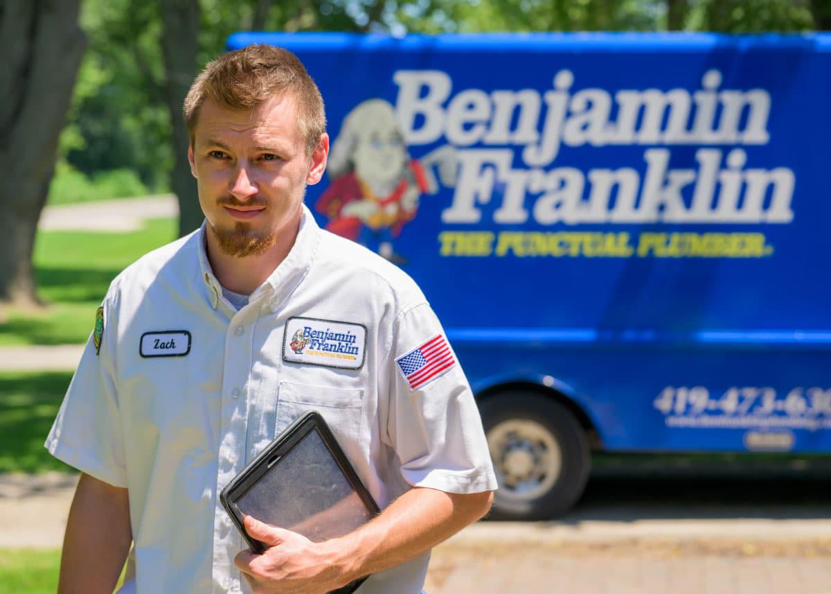 Benjamin Franklin Plumbing of Myrtle Beach working walking away from work van