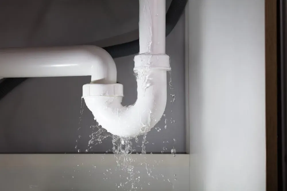 Why is water leaking from under my sink?