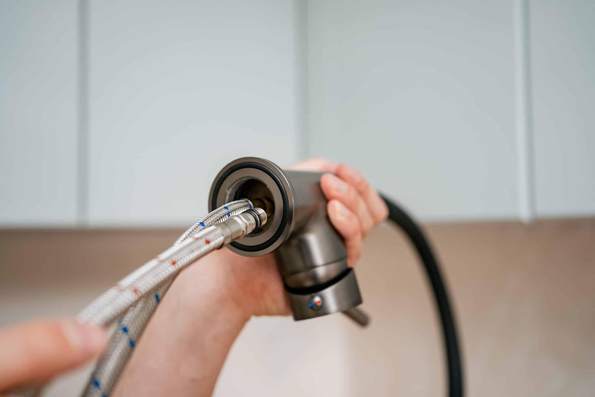 plumber connecting flexible water line