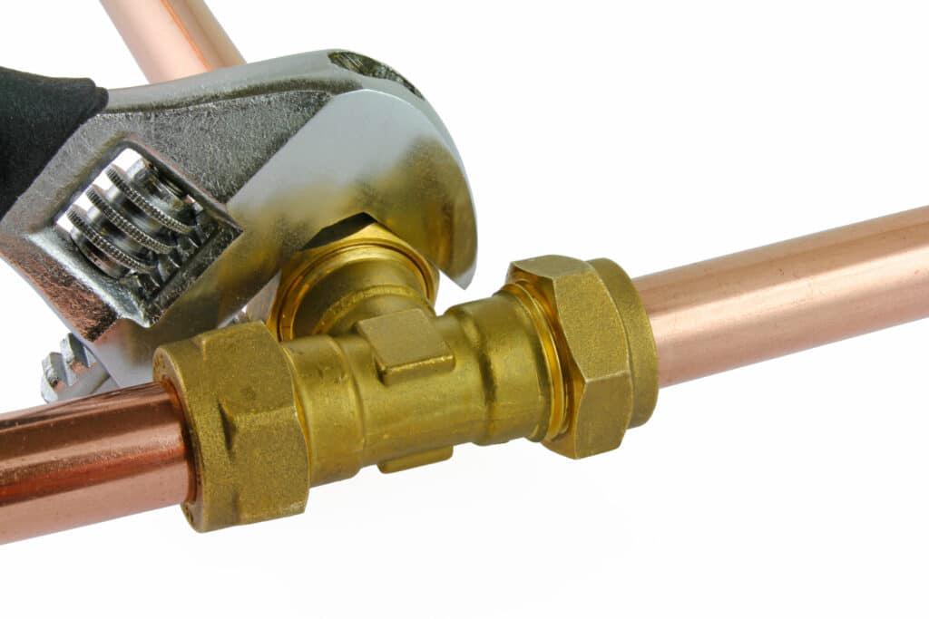 wrench tightening copper pipe