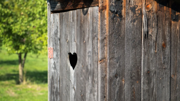 outhouse with heart shape in wood