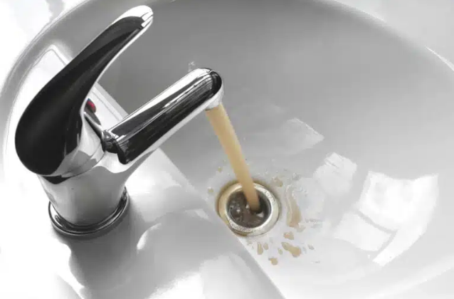 brown water coming out of faucet going down drain 