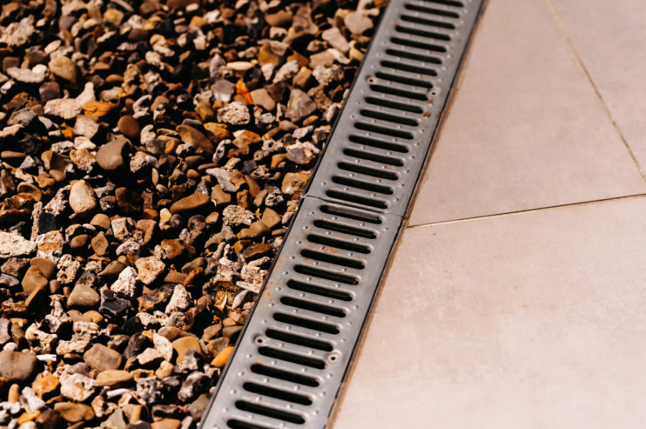 outdoor drain next to rocks