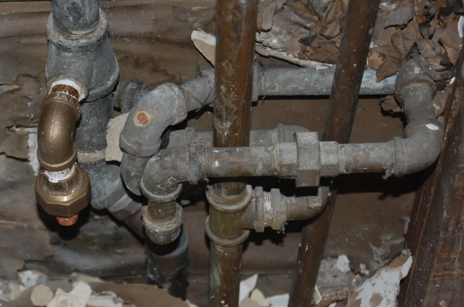 cast iron plumbing in wall