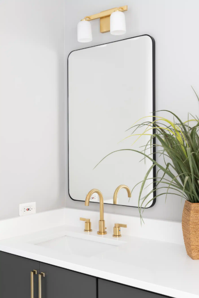 bathroom sink with gold faucet