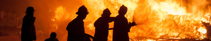 Fire fighters extinguishing fire